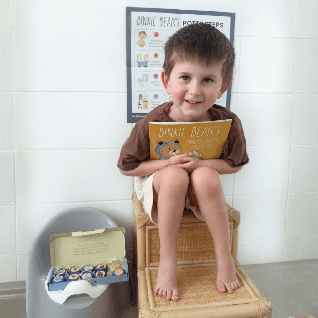 A toddler using the toilet confidently at home
